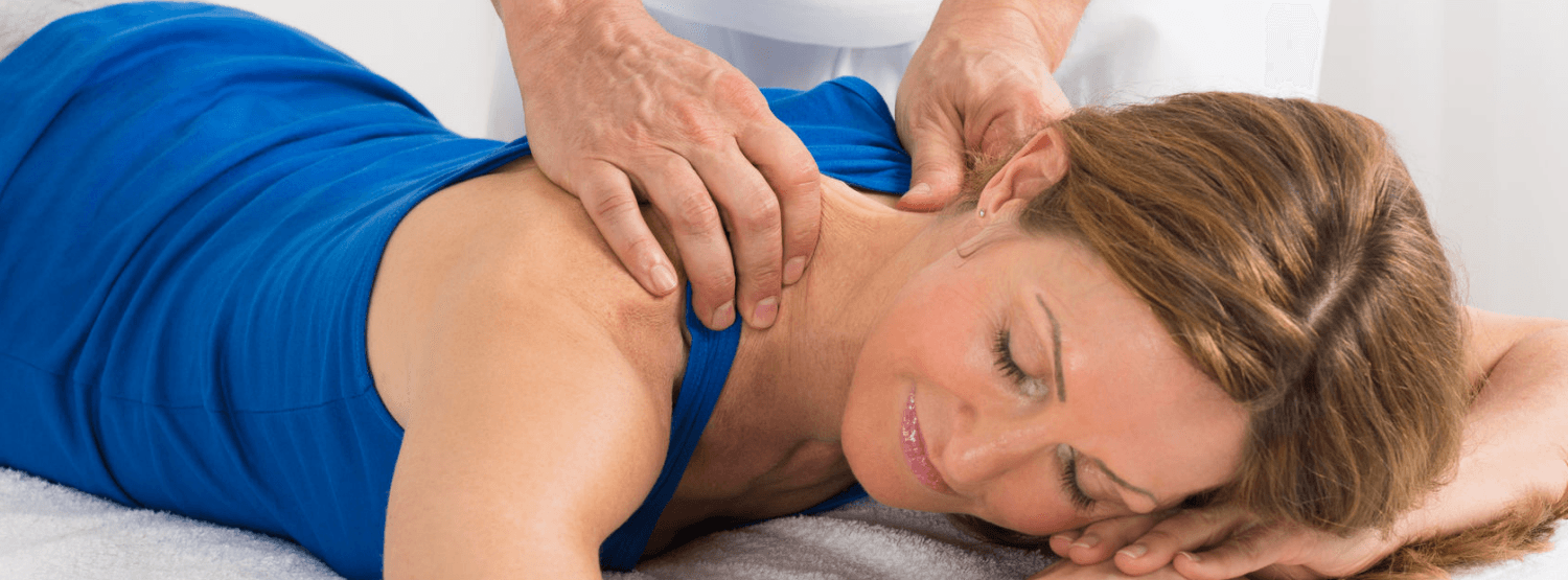 Massage by physiotherapist on shoulders